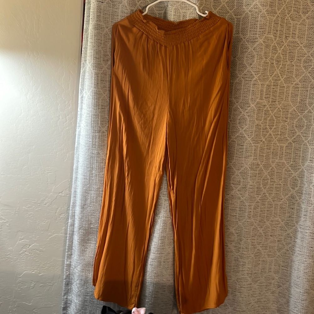 Women’s trousers in the color burnt orange can be dressed up or down